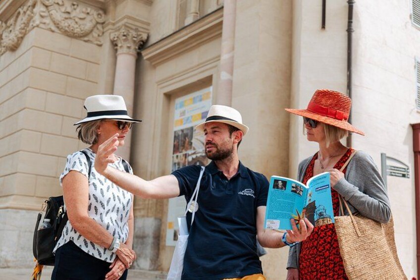 Three people walking, one holding a map. 5