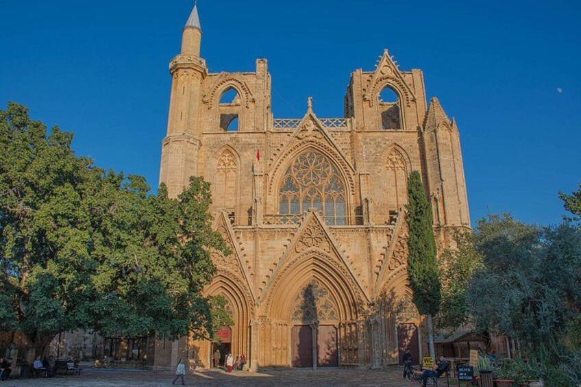 A historic cathedral with Gothic architecture, including pointed arches and a large rose window. 5
