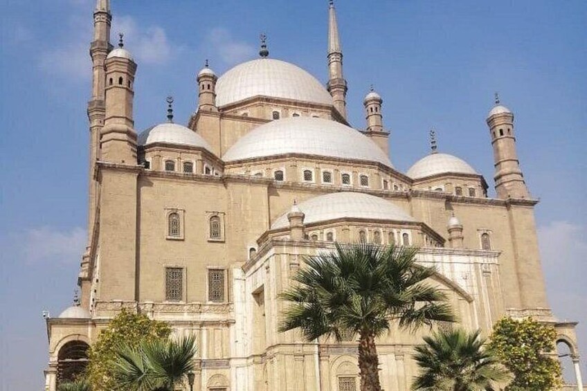 A large mosque with multiple domes and minarets. 2