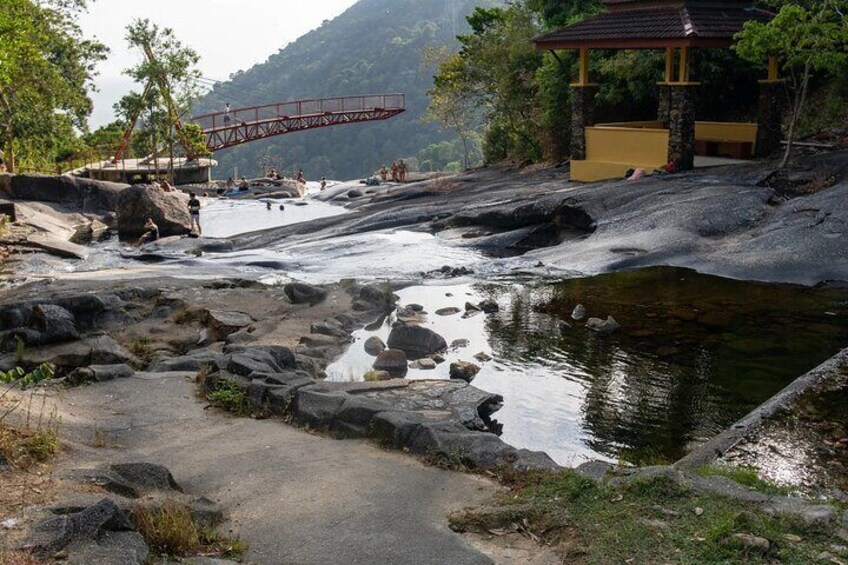 Cooling down in a refreshing natural pool is the reward for hiking through the humid rainforest to reach the zen-laden waterfall 2
