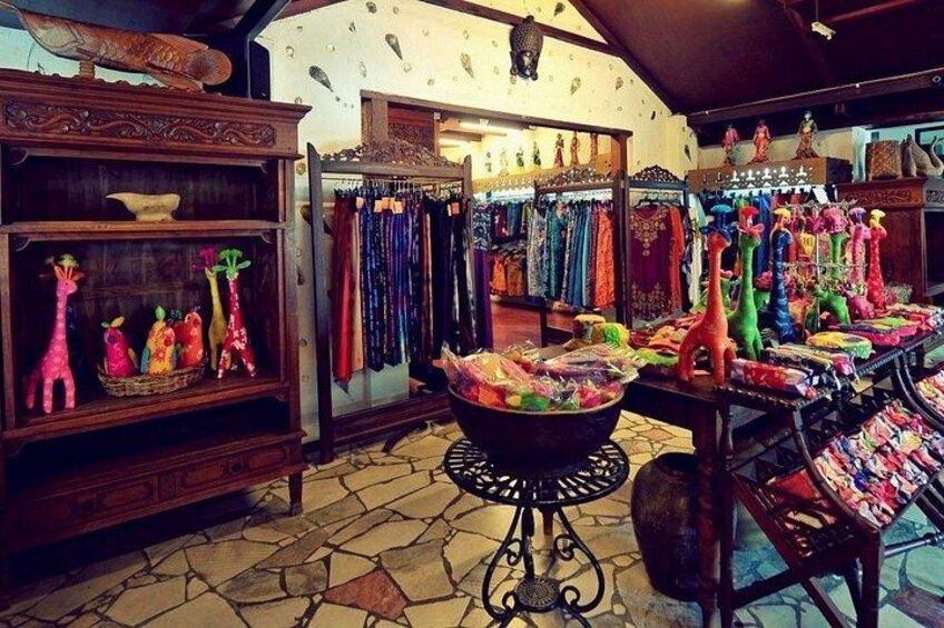 A shop with colorful items on display, including stuffed animals and clothing. 2