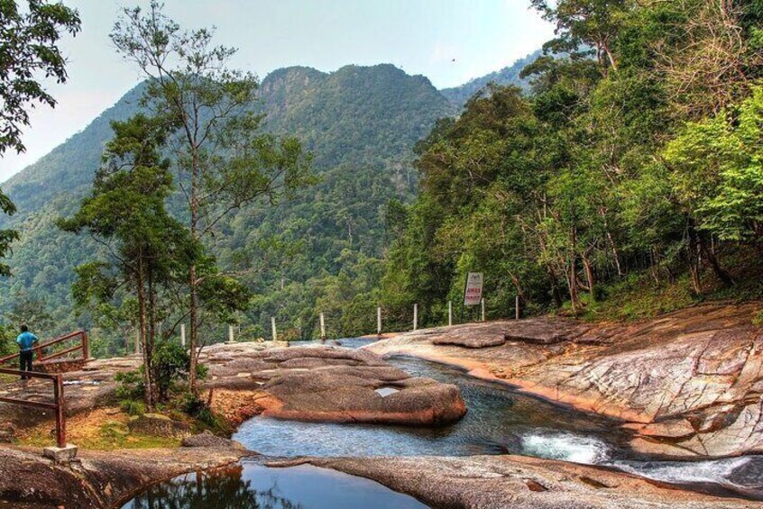 Cooling down in a refreshing natural pool is the reward for hiking through the humid rainforest to reach the zen-laden waterfall 4
