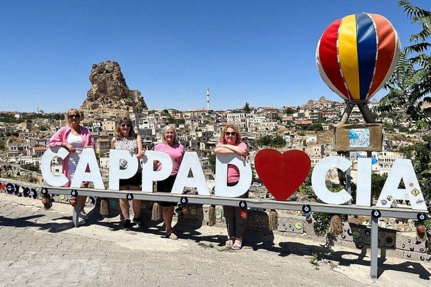 A sign with the word 'Cappadocia' and a heart symbol. 1