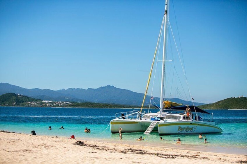 Travelers enjoy the calm waters alongside their catamaran during an island excursion from San Juan, Puerto Rico. 5