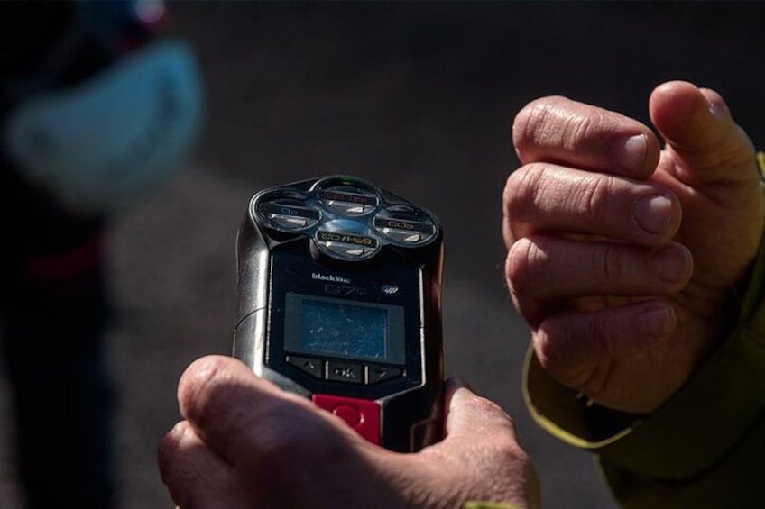 A person holding a Blackberry device with a screen displaying 'BlackBerry' and a red button. 4