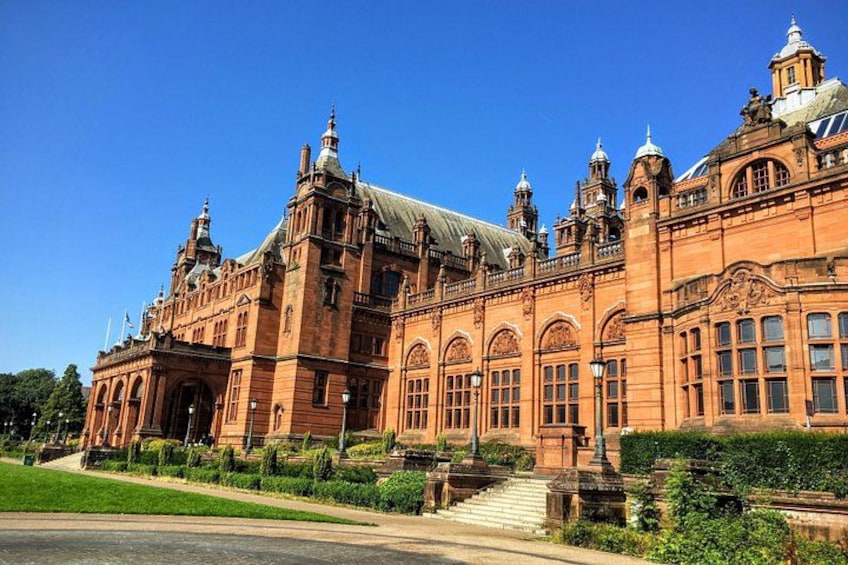 A large, ornate building with multiple towers and arched windows. 1