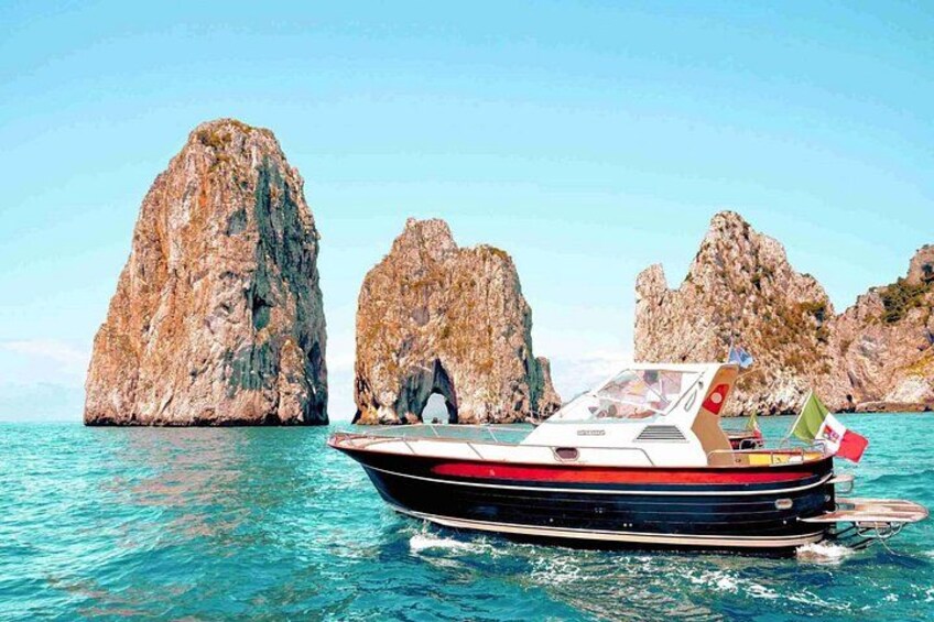 Our boats and the iconic Faraglioni rocks. 2
