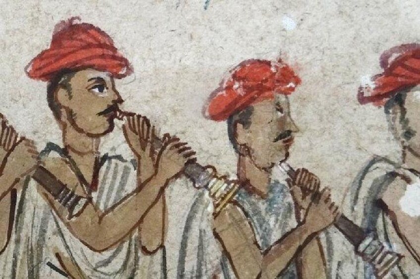 A mural with figures wearing red headgear and holding objects. 1