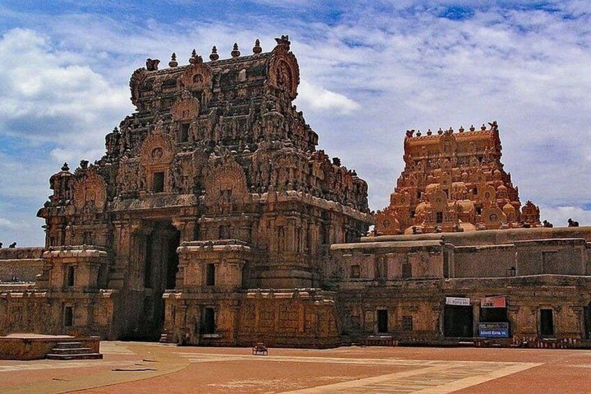 A large, ornate temple with intricate carvings and a smaller adjacent structure. 4