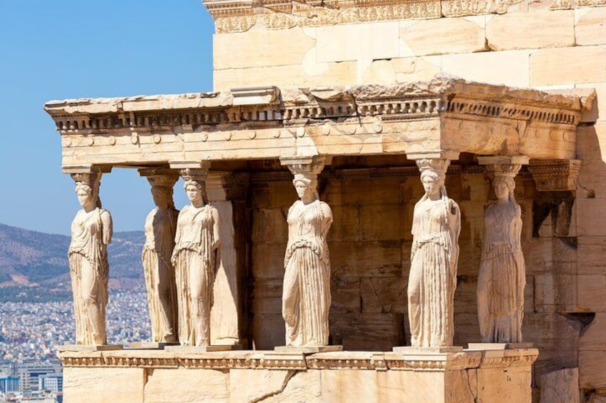 A classical Greek temple with Doric columns and statues. 2