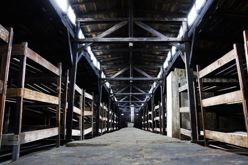 An industrial warehouse with metal shelving units and a concrete floor. 2