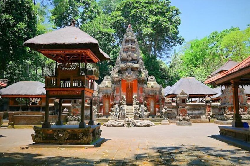 A temple complex with a central stupa, surrounding structures, and a paved courtyard. 4