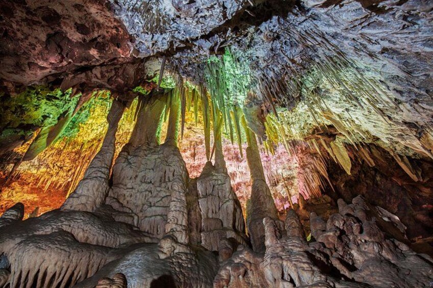A cave with colorful stalactites and stalagmites. 3