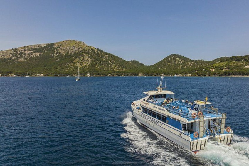 A boat on a body of water with mountains in the background. 5