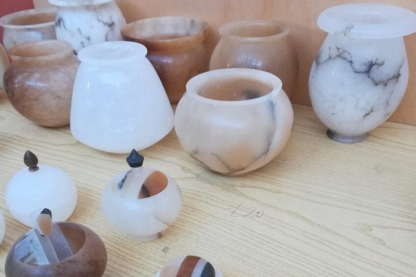 A collection of pottery on a wooden surface. 2