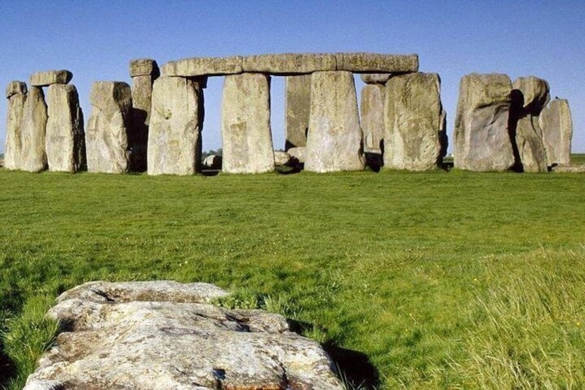 Stonehenge standing in a grassy field. 4