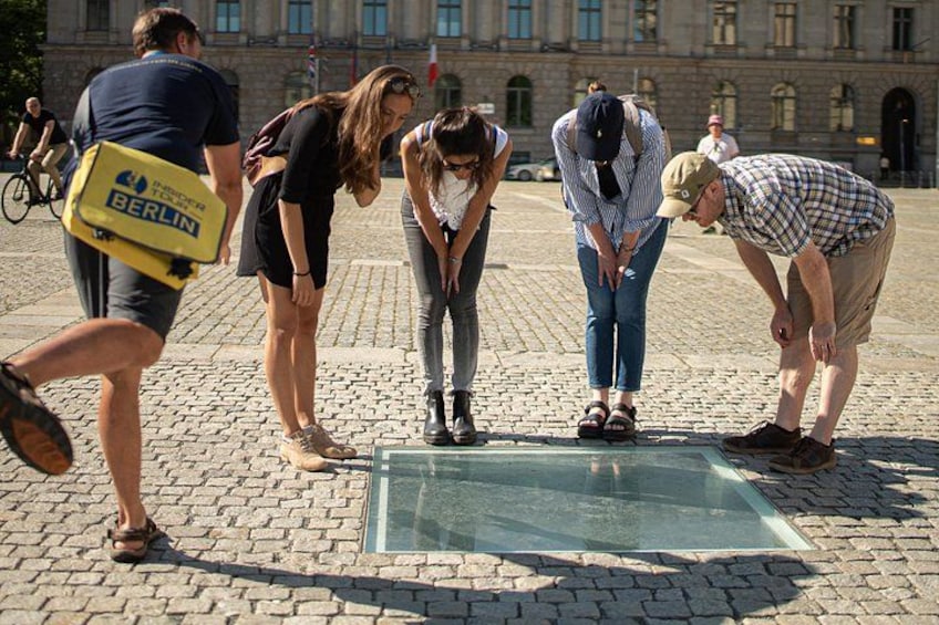 Guide and group at the book-burning memorial 3