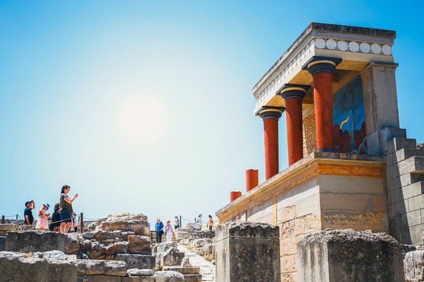 Ancient ruins with columns and a partially visible mural. 5
