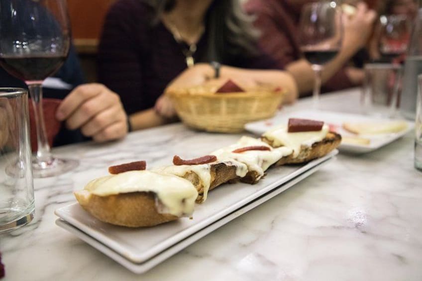 Restaurant guests bite into “manchego,” cheese made of sheep’s milk, with “membrillo,” or quince paste. 4