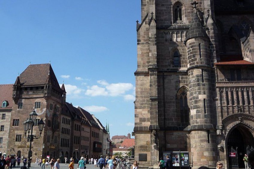 A historic building with a tower and a large arched entrance. 2