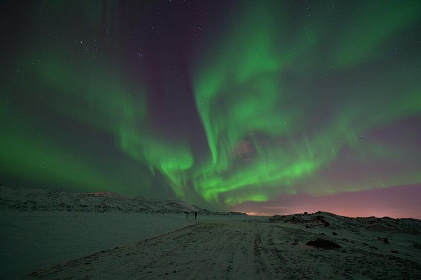 A snowy landscape with the aurora borealis. 2