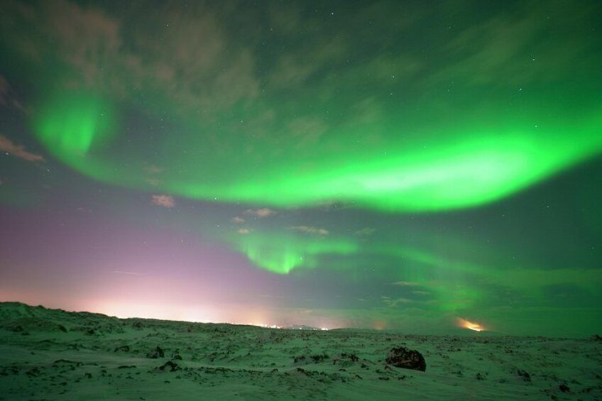 A snowy landscape with the aurora borealis. 3