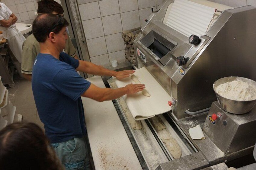 Guests enjoying the behind the scenes access of a "Boulangerie" (Bakery) with A Taste of Paris 3