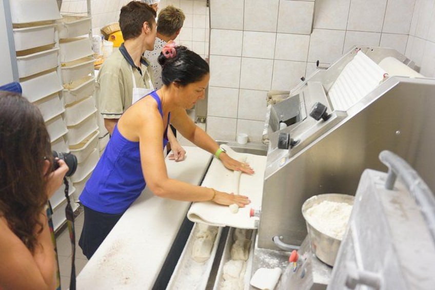 Guests enjoying the behind the scenes access of a "Boulangerie" (Bakery) with A Taste of Paris 4