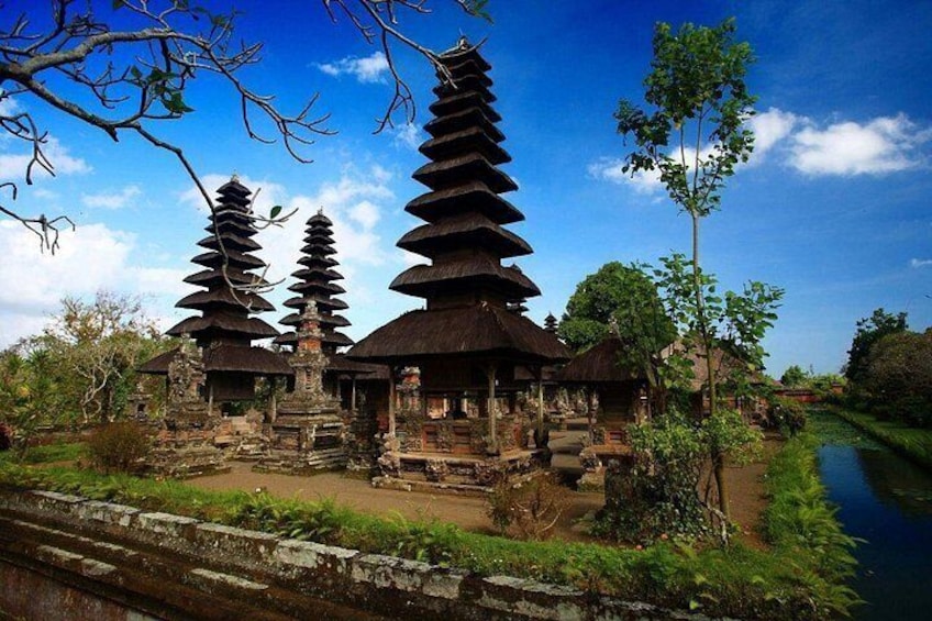 Traditional tiered pagodas, a river, and lush greenery. 5