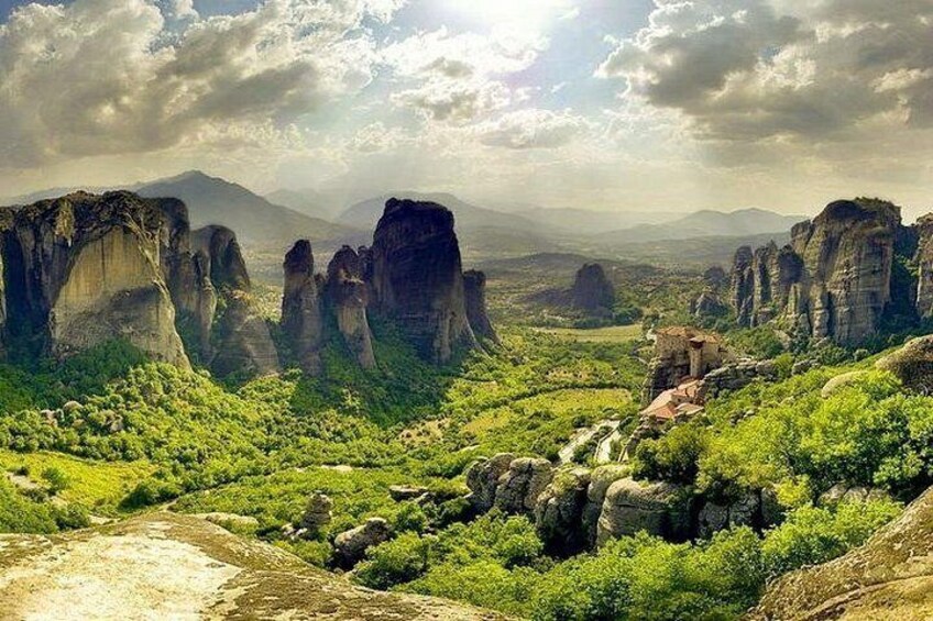 A landscape with rock formations and greenery. 4