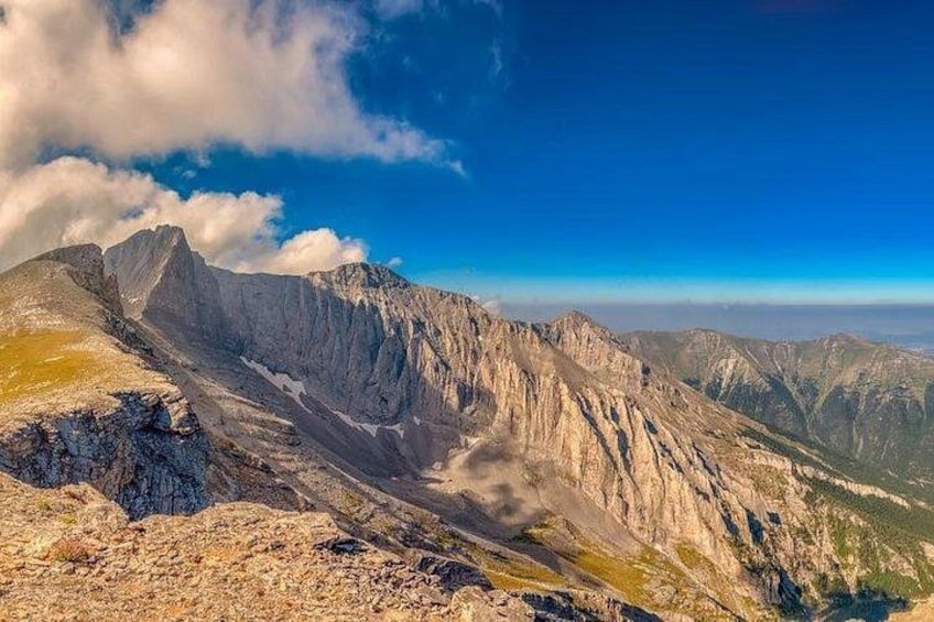 A mountain landscape with rocky terrain and a clear sky. 3