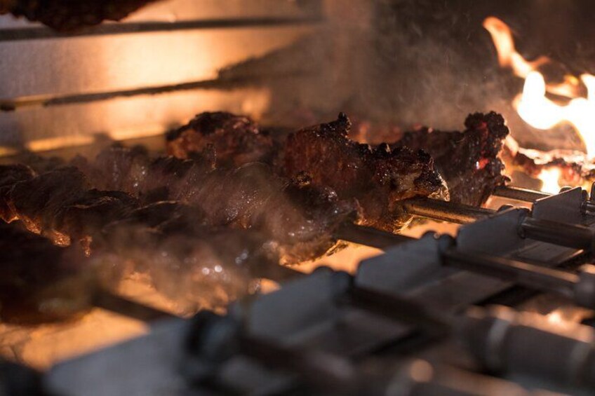 Meat grilling over an open flame. 3