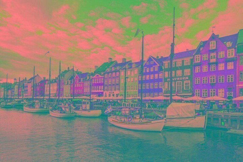 A harbor with colorful buildings and boats. 1