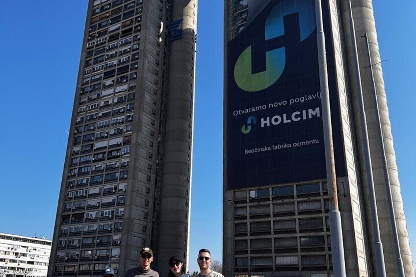 A tall building with a large advertisement for Holcim. 4