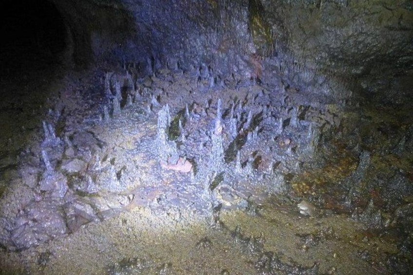 A cave with stalactites and stalagmites. 2