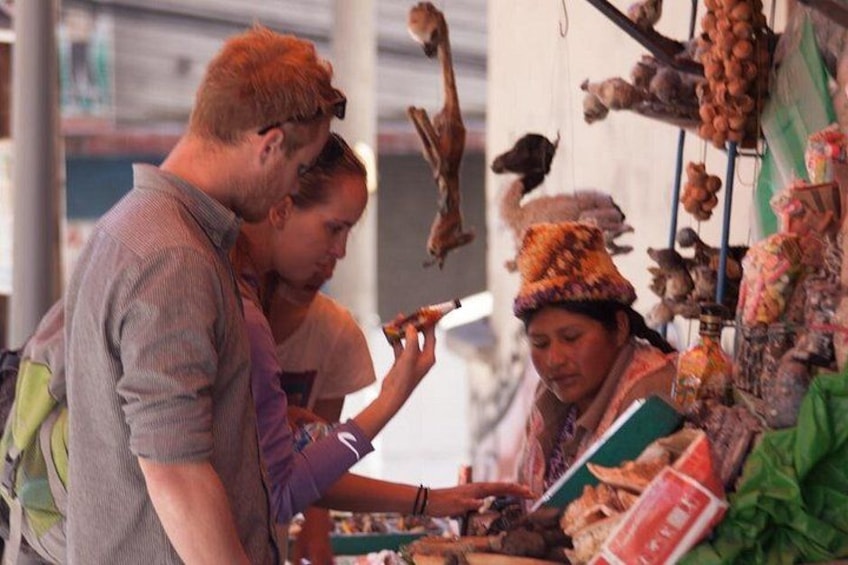 A market stall with various goods, including hanging items and books. 5