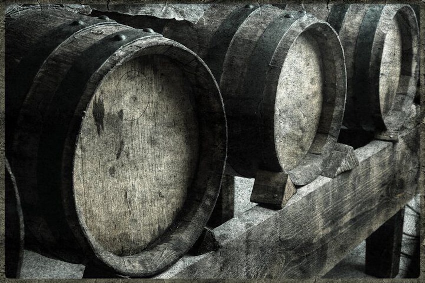 Wooden barrels stacked on a wooden rack. 2