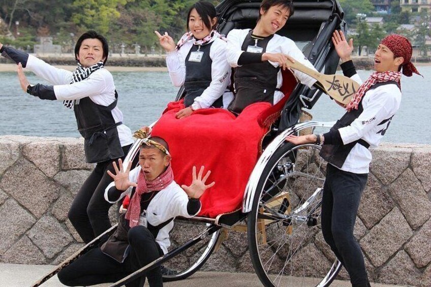 A group of people in traditional attire around a horse-drawn carriage. 3