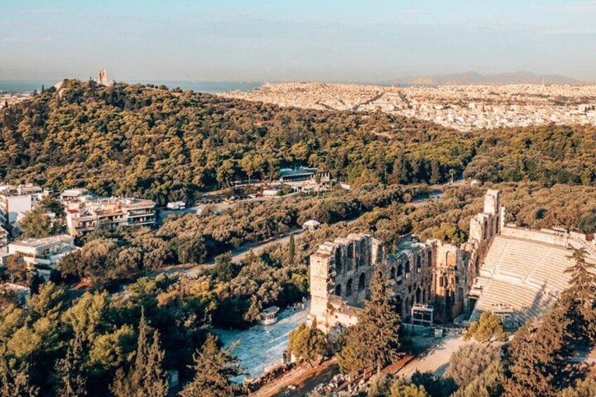 A historic cathedral with a river, surrounded by dense greenery and urban buildings. 2