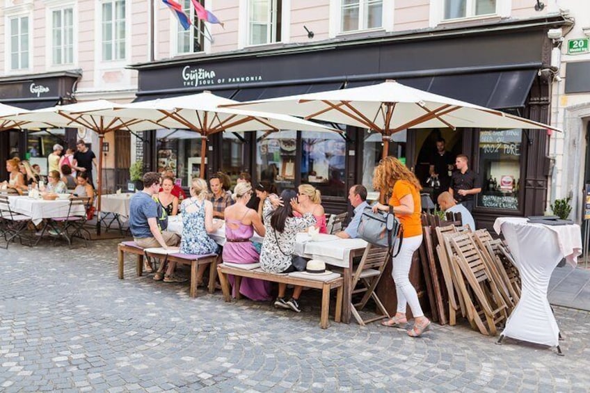 Outdoor dining at a restaurant with tables and umbrellas. 3