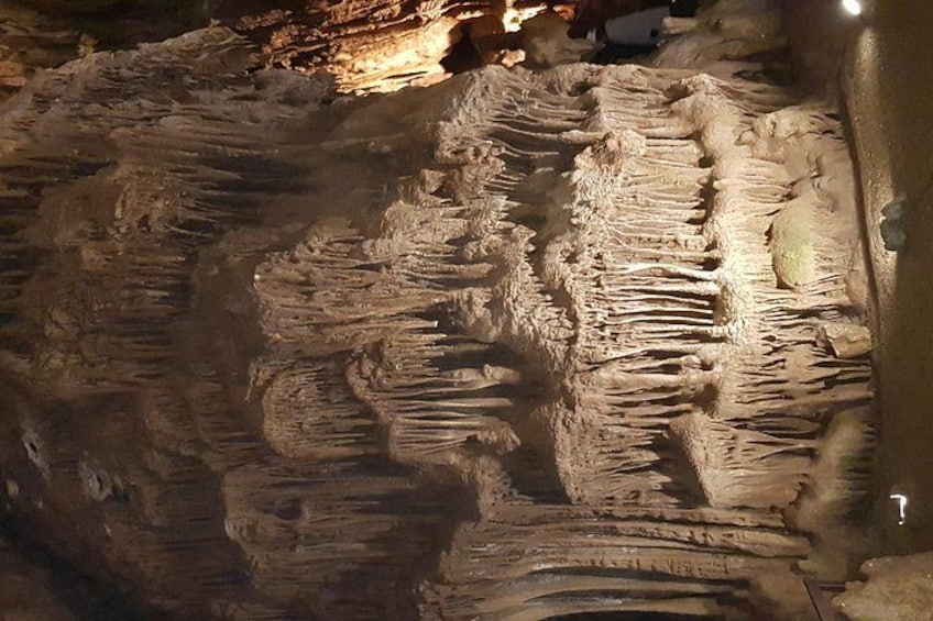 A cave with stalactites and stalagmites. 1