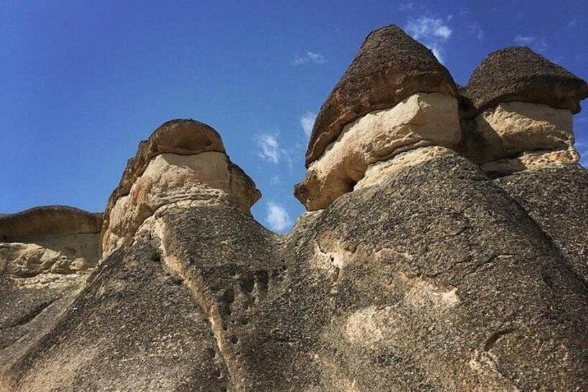 A rock formation with layered sedimentary structures. 5