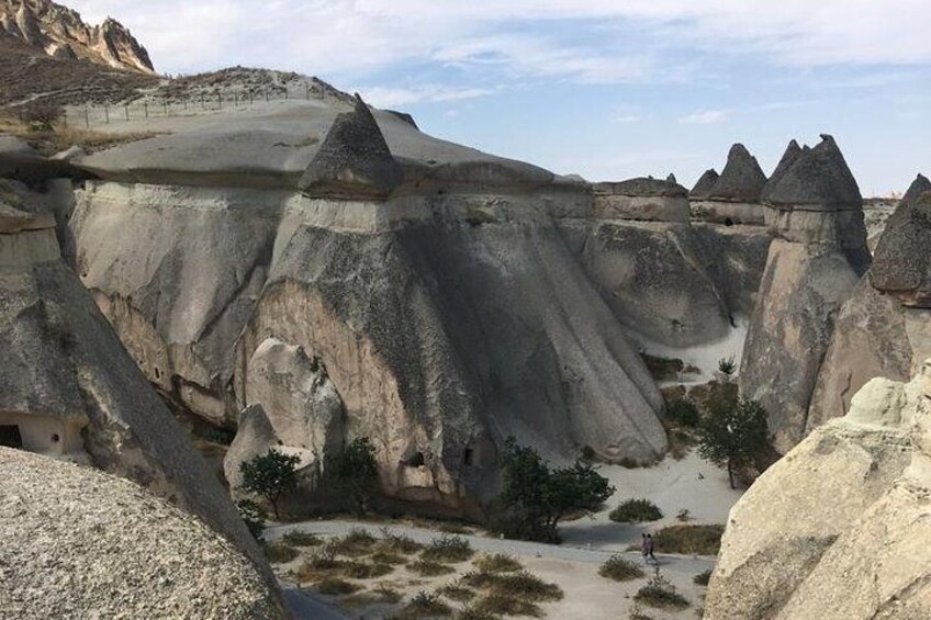A landscape with prominent hoodoos and a clear sky. 4