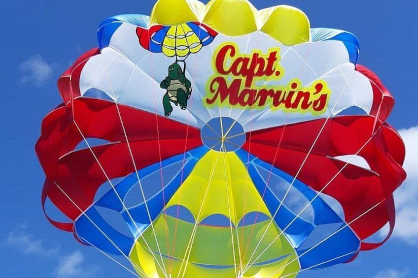 A parachute with the text 'Capt. Marvin's' and a cartoon turtle. 4