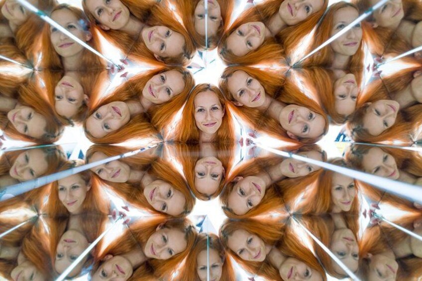 A symmetrical pattern of a person with red hair. 1