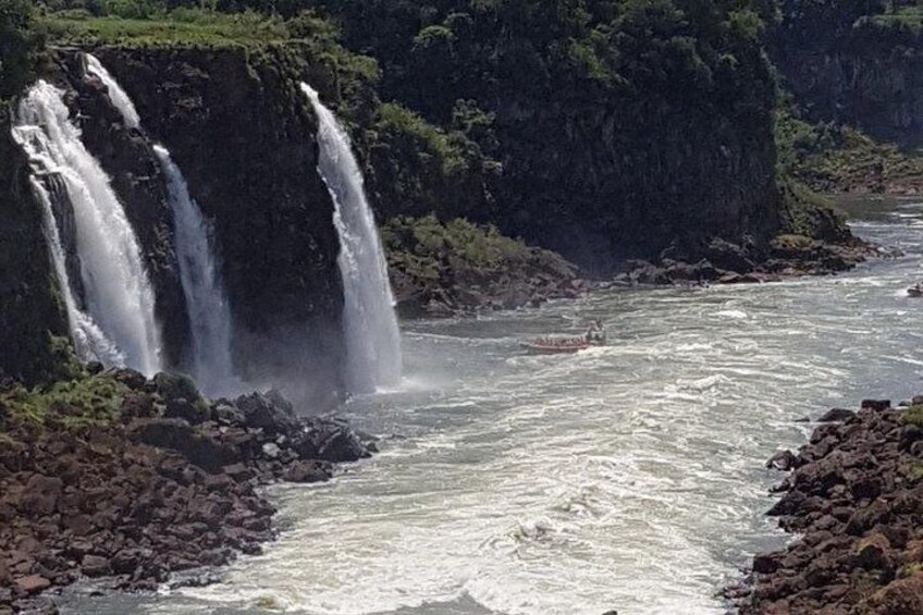 A waterfall, a river, and rocky terrain. 4
