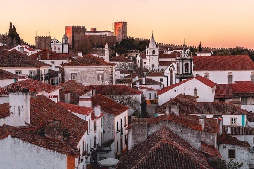 Óbidos is a medieval town with cobblestone streets and flower-bedecked, whitewashed houses 3