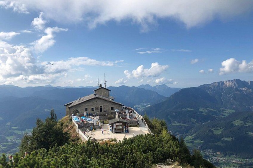 A mountain lodge with a view of the surrounding landscape. 4
