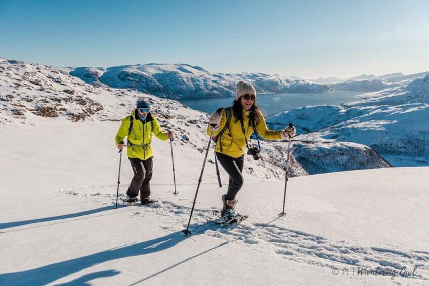 Lucky snowshoers under the sunny light of early spring 3