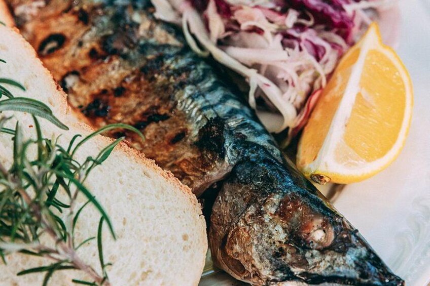 Grilled fish accompanied by our signature salad 4